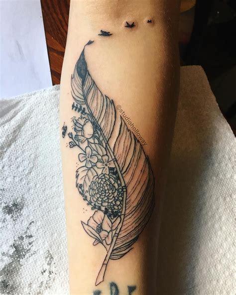 feather and flower tattoo